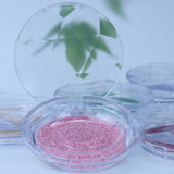A Pair Of Round Eyelash Boxes
